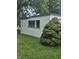 Exterior view of the garage with green space at 3216 Memorial N Dr, Elwood, IN 46036