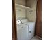 A laundry room features shelving, flooring, and a washer and dryer at 3216 Memorial N Dr, Elwood, IN 46036