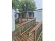 A wooden ramp leads to the entrance of the mobile home at 3216 Memorial N Dr, Elwood, IN 46036