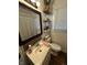 Bathroom features a white vanity, a toilet, floating shelves, decor, and a large framed mirror at 3711 Hillside Ave, Indianapolis, IN 46218