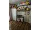 Charming bedroom with ample shelving, a closet and decorative stuffed animals at 3711 Hillside Ave, Indianapolis, IN 46218