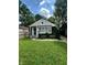Charming home with green lawn, landscaping, and inviting front entrance offers great curb appeal at 3711 Hillside Ave, Indianapolis, IN 46218