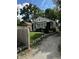Home exterior showcasing landscaped yard, inviting entrance, and a well-maintained driveway at 3711 Hillside Ave, Indianapolis, IN 46218