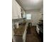 Galley kitchen featuring granite countertops, stainless steel appliances, and ample cabinet space at 3711 Hillside Ave, Indianapolis, IN 46218
