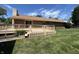 Expansive backyard featuring a well-maintained lawn and a wooden deck, perfect for outdoor entertaining at 4675 N Riverside Dr, Columbus, IN 47203