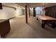 Spacious basement with carpeted floor, pool table, and carpeted stairs at 4675 N Riverside Dr, Columbus, IN 47203