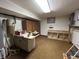 Unfinished basement area with workbench, cabinets, and utility connections at 4675 N Riverside Dr, Columbus, IN 47203