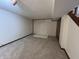 Spacious basement featuring neutral carpeting and a painted brick accent wall, perfect for customization at 4675 N Riverside Dr, Columbus, IN 47203