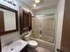 Bathroom featuring a shower, cabinet, toilet, and vanity with sink, and a wood-look flooring at 4675 N Riverside Dr, Columbus, IN 47203