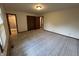 Carpeted bedroom with closet doors and access to ensuite bathroom at 4675 N Riverside Dr, Columbus, IN 47203