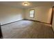 Spacious bedroom featuring carpet flooring and natural light at 4675 N Riverside Dr, Columbus, IN 47203