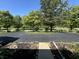 Image of a driveway leading to a property, lined with trees and greenery at 4675 N Riverside Dr, Columbus, IN 47203