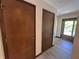 Inviting hallway with wood-look floors and natural light at 4675 N Riverside Dr, Columbus, IN 47203