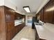 Galley kitchen featuring ample wood cabinetry and stainless steel appliances at 4675 N Riverside Dr, Columbus, IN 47203