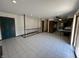 Open concept living room with tile flooring and view of the kitchen at 4675 N Riverside Dr, Columbus, IN 47203