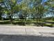 Street view showing mature trees and well-maintained grounds at 4675 N Riverside Dr, Columbus, IN 47203