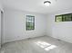 Well-lit bedroom features two windows, neutral carpet, and fresh, white walls at 4765 E 200 N, Anderson, IN 46012