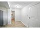A bright hallway with a doorway leading to another room, offering an open and inviting space at 4765 E 200 N, Anderson, IN 46012