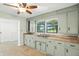 The kitchen offers views of the flooring, sink, cabinets, and an open door in an open-concept floor plan at 4765 E 200 N, Anderson, IN 46012