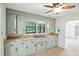 A quaint kitchen featuring abundant cabinet space, a double sink, and bright natural light at 4765 E 200 N, Anderson, IN 46012
