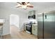Efficient kitchen with stainless steel appliances, natural wood countertops, and neutral walls at 4765 E 200 N, Anderson, IN 46012