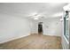 Spacious living room with hardwood floors, modern ceiling fan, and light, neutral walls at 4765 E 200 N, Anderson, IN 46012