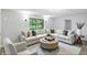 Bright and airy living room with stylish furniture, modern decor, and a large window at 4765 E 200 N, Anderson, IN 46012