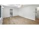 Bright, open living room with hardwood floors, contemporary ceiling fan, and neutral walls at 4765 E 200 N, Anderson, IN 46012