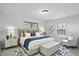 Stylishly furnished main bedroom with windows, chic rug, bed, and matching side tables at 4765 E 200 N, Anderson, IN 46012