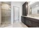 This bath features a standing shower and an oversized cabinet next to the double sink vanity at 4909 N Graystone Dr, Muncie, IN 47304