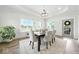 Dining room featuring hardwood floors, natural light, and dining table at 4909 N Graystone Dr, Muncie, IN 47304