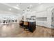 Modern kitchen with dark island, marble countertops, stainless appliances, and hardwood floors at 4909 N Graystone Dr, Muncie, IN 47304