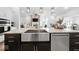 Kitchen with island and stainless steel appliances that opens to the living room at 4909 N Graystone Dr, Muncie, IN 47304