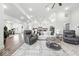 Bright open-concept living room boasts hardwood floors, neutral tones, and modern furniture at 4909 N Graystone Dr, Muncie, IN 47304