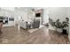 Spacious living room boasts modern fireplace, hardwood floors, and bright, open layout perfect for entertaining at 4909 N Graystone Dr, Muncie, IN 47304