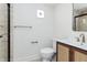 Well-lit bathroom features a tiled shower and an elegant vanity with modern sink fixtures at 5930 Broadway St, Indianapolis, IN 46220