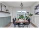 Dining room features a modern light fixture, wainscoting, and lots of natural light at 5930 Broadway St, Indianapolis, IN 46220