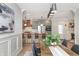 Open concept dining room and kitchen with modern decor and lots of natural light at 5930 Broadway St, Indianapolis, IN 46220