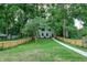 Charming two-story home with a lush front yard and a fenced perimeter at 5930 Broadway St, Indianapolis, IN 46220