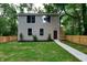 Charming two-story home with a well-manicured front yard and inviting porch at 5930 Broadway St, Indianapolis, IN 46220