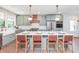 Stylish kitchen with a large island, marble countertops, and stainless steel appliances at 5930 Broadway St, Indianapolis, IN 46220