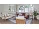 Upstairs living room with lots of natural light, a brown leather sofa, and hardwood floors at 5930 Broadway St, Indianapolis, IN 46220