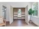 Spacious walk-in closet featuring shelving units, a window, and lots of storage at 5930 Broadway St, Indianapolis, IN 46220