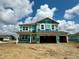 View of a two-story home under construction, showcasing the exterior design and garage at 6016 Granby Dr, Whitestown, IN 46075