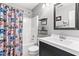 Well-lit bathroom features a shower-tub combo with a construction-themed shower curtain at 6102 Boulder Dr, Anderson, IN 46013