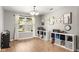 Bright dining area with hardwood floors, playful decor, and a large window at 6102 Boulder Dr, Anderson, IN 46013