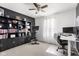 Stylish home office with a large built-in bookshelf, a workspace, and a stationary bike at 6102 Boulder Dr, Anderson, IN 46013