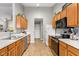Efficient kitchen with wood cabinets, white countertops, and ample storage space at 6102 Boulder Dr, Anderson, IN 46013