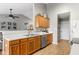 Bright kitchen featuring wood cabinets, stainless steel appliances, and an open concept design at 6102 Boulder Dr, Anderson, IN 46013