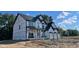 New home featuring a three-car garage and a covered entryway at 6279 Rippling Rock Dr, Plainfield, IN 46168